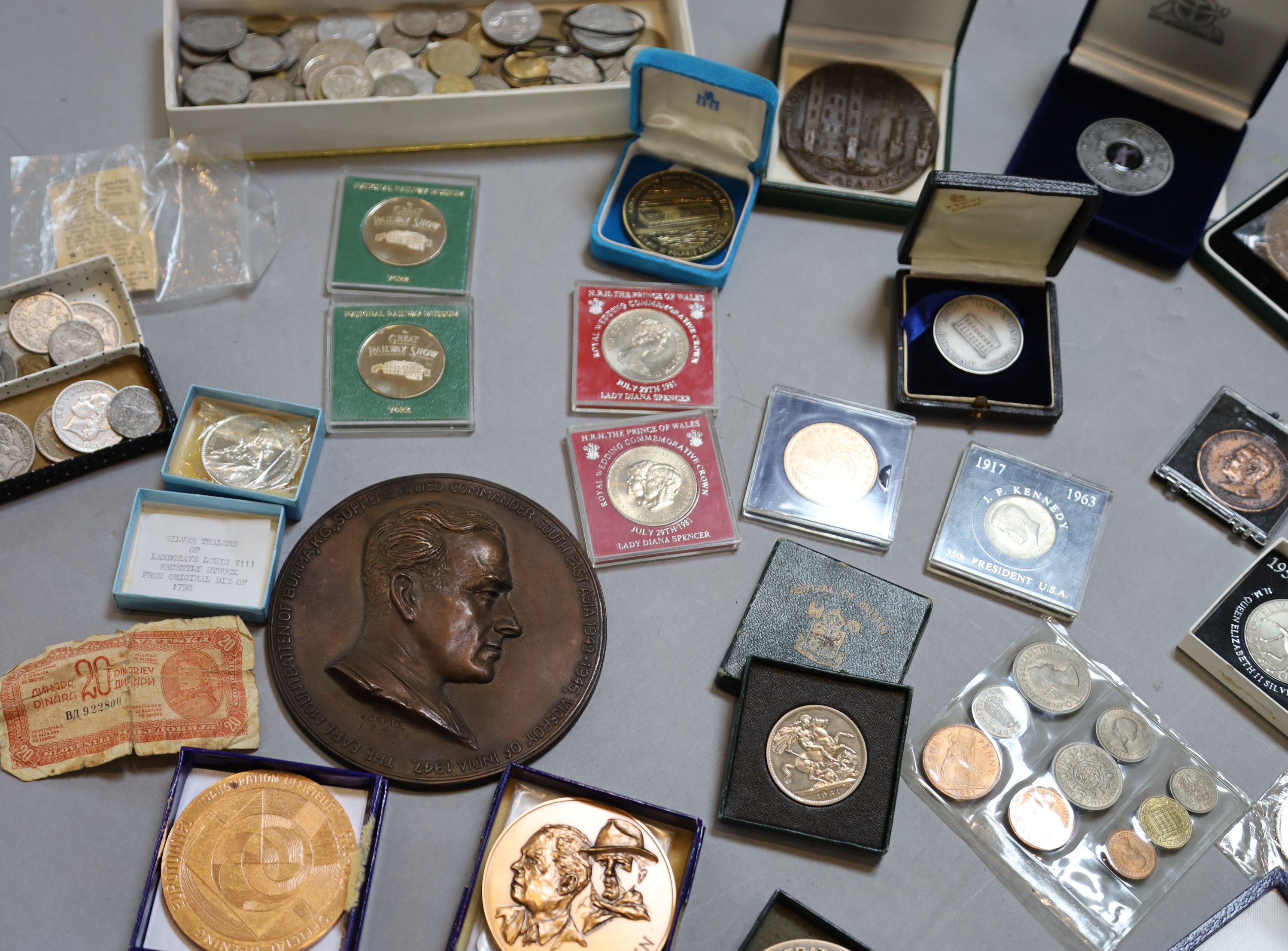 A collection of assorted coins and medallions